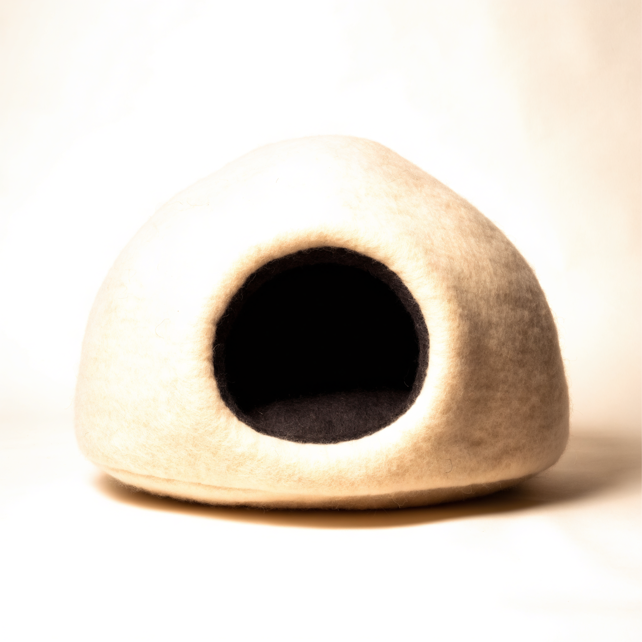 Cream felted wool cat cave with round opening