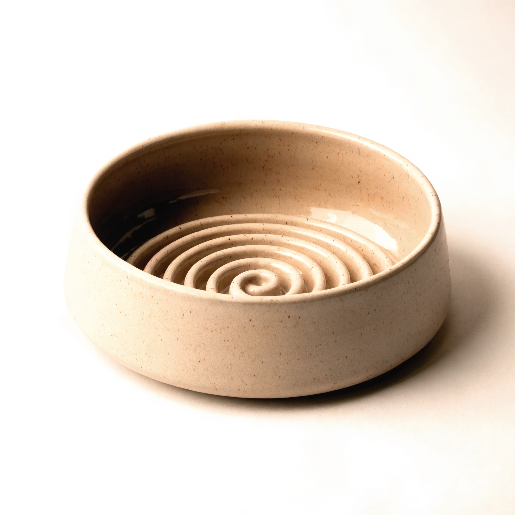 Speckled ceramic slow feeder dog bowl with spiral maze interior